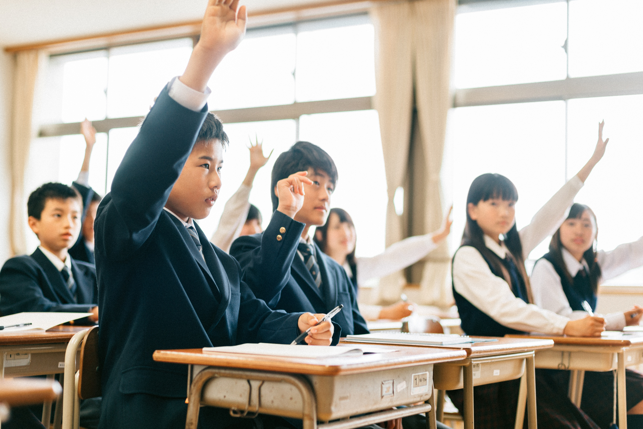 Japanese Junior High School Students Raising hands